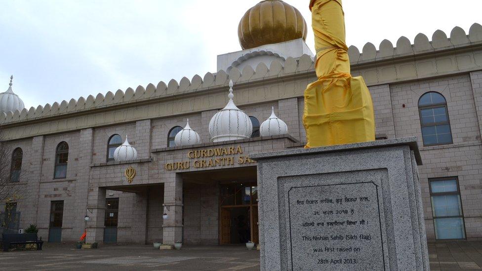 A view of the Glasgow Gurdwara and flag pole outside its entrance