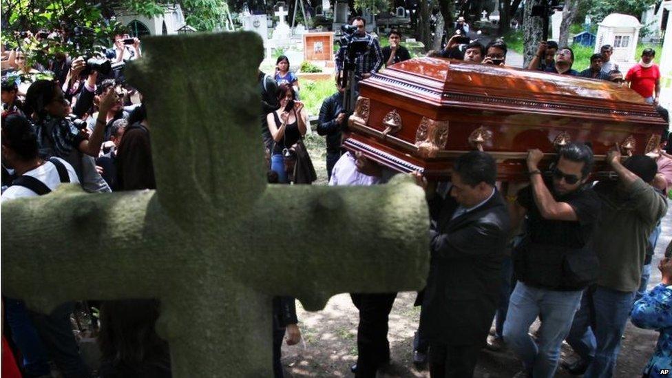 Men carry the casket of murdered photojournalist Ruben Espinosa during his funeral service in Mexico City on 3 August, 2015.