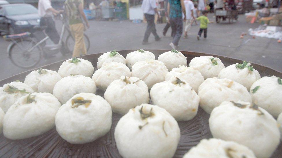 Steaming buns on sale at a roadside stall in Beijing, China