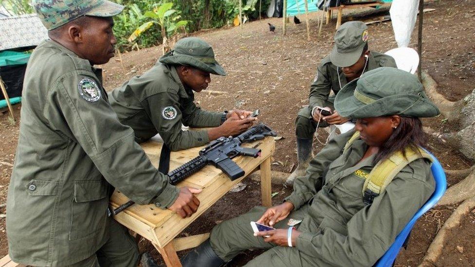 A member from Revolutionary Armed Forces of Colombia (FARC) rests in a transitory camp in Tumaco town, Narino, southwest of Colombia, 8 March 2017