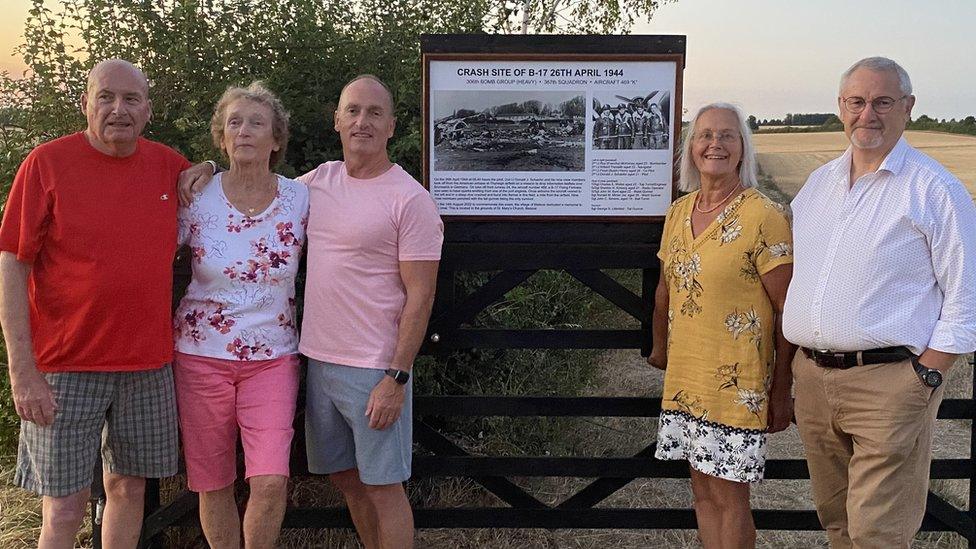 Michael Collins, Marie Devine, and George Curtin, Mary and Paul Laws my a memorial display in Bletsoe, Bedfordshire