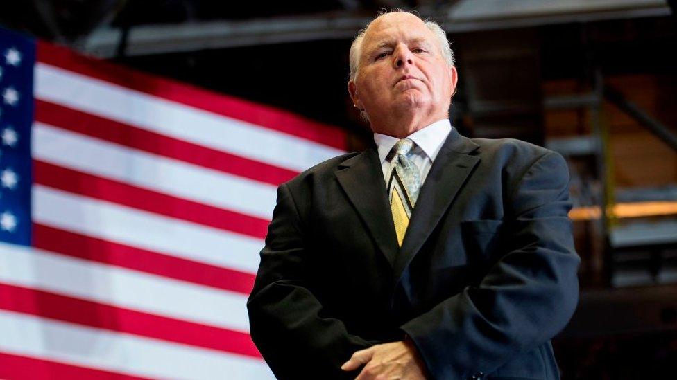 US radio talk show host and conservative political commentator Rush Limbaugh at 2018 Trump rally in front of a US flag