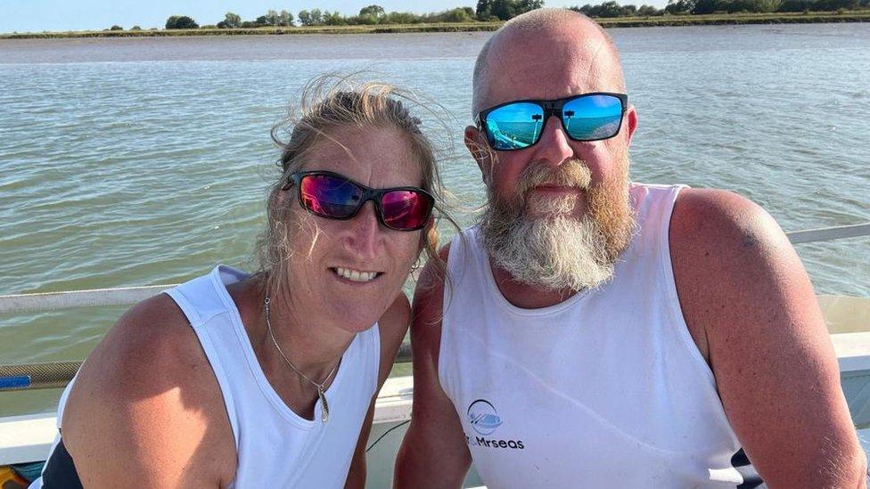 Nina and Simon Crouchman on a boat on the water