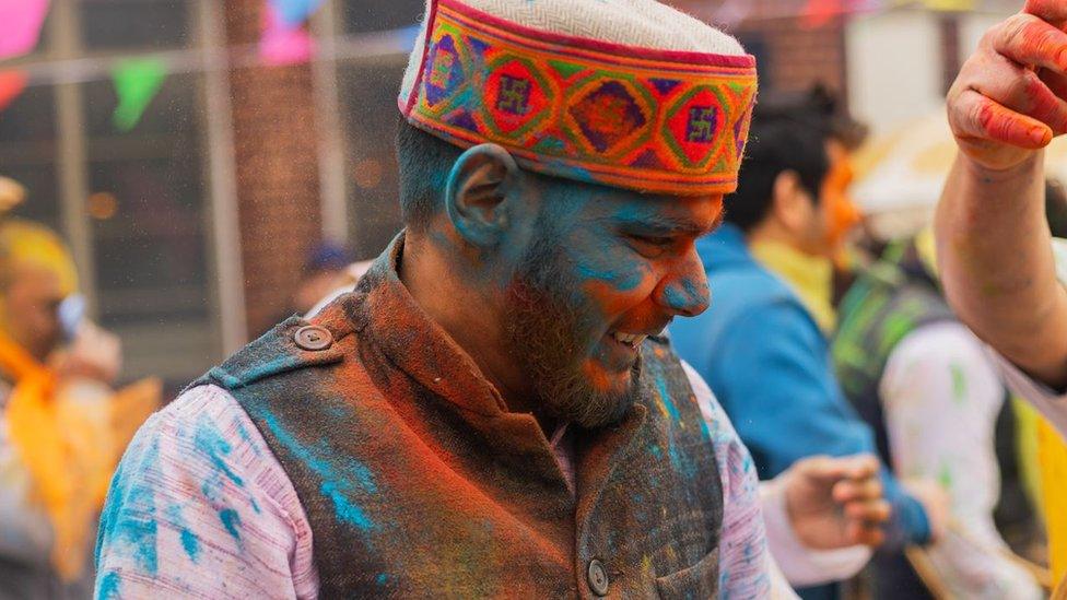 A man at a Holi celebration