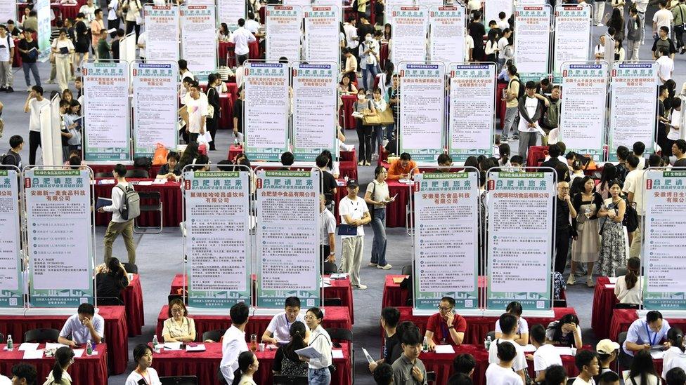 People attend a job fair for university graduates at a gymnasium in Hefei, Anhui province, China September 4, 2023.