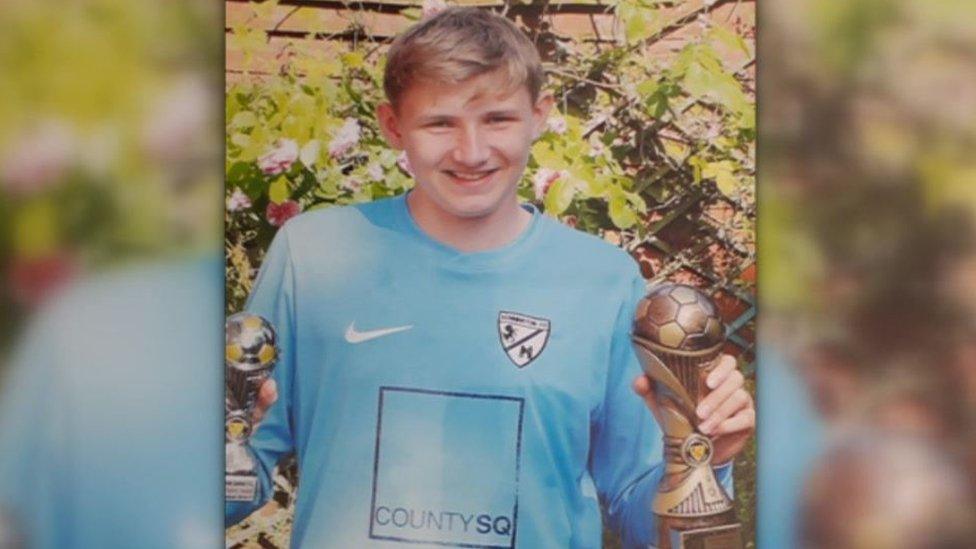 Owen Kinghorn, pictured in sports clothes, holding trophies