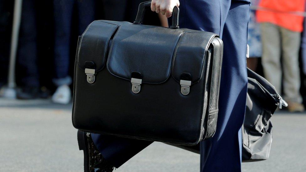 Obama aide carries nuclear briefcase