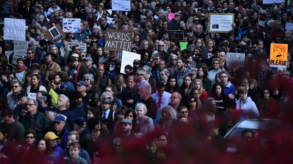 Protesters held signs saying 'words matter' and 'renounce white nationalism'