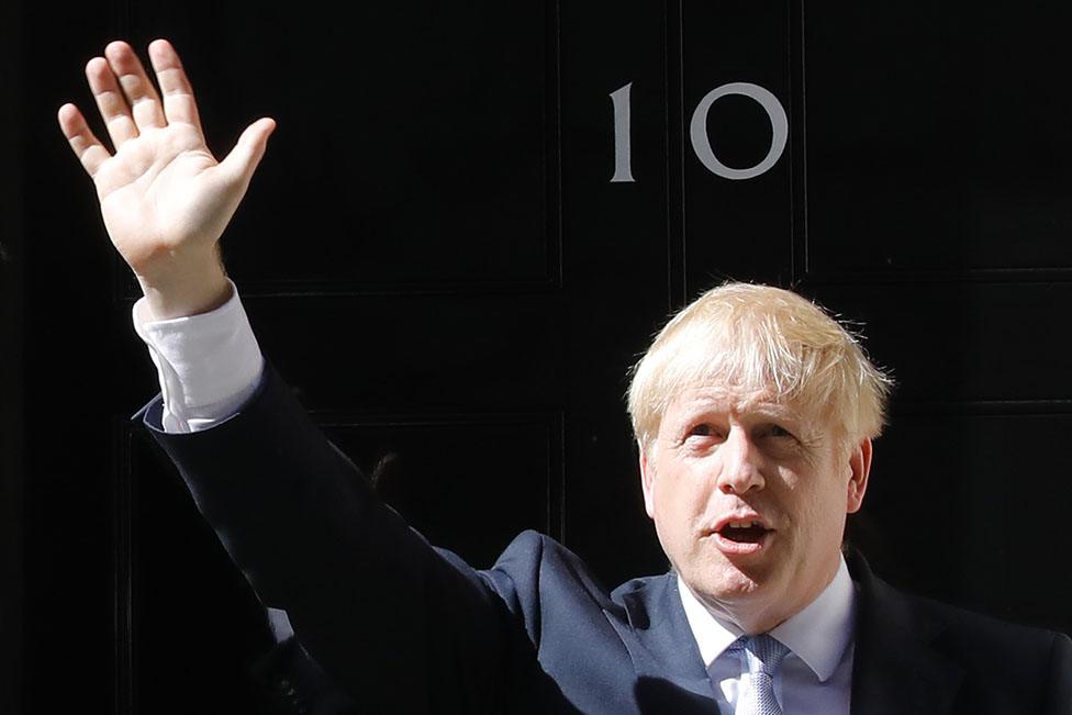 Britain's new Prime Minister Boris Johnson waves after giving a speech outside 10 Downing Street in London on July 24, 2019 on the day he was formally appointed British prime minister