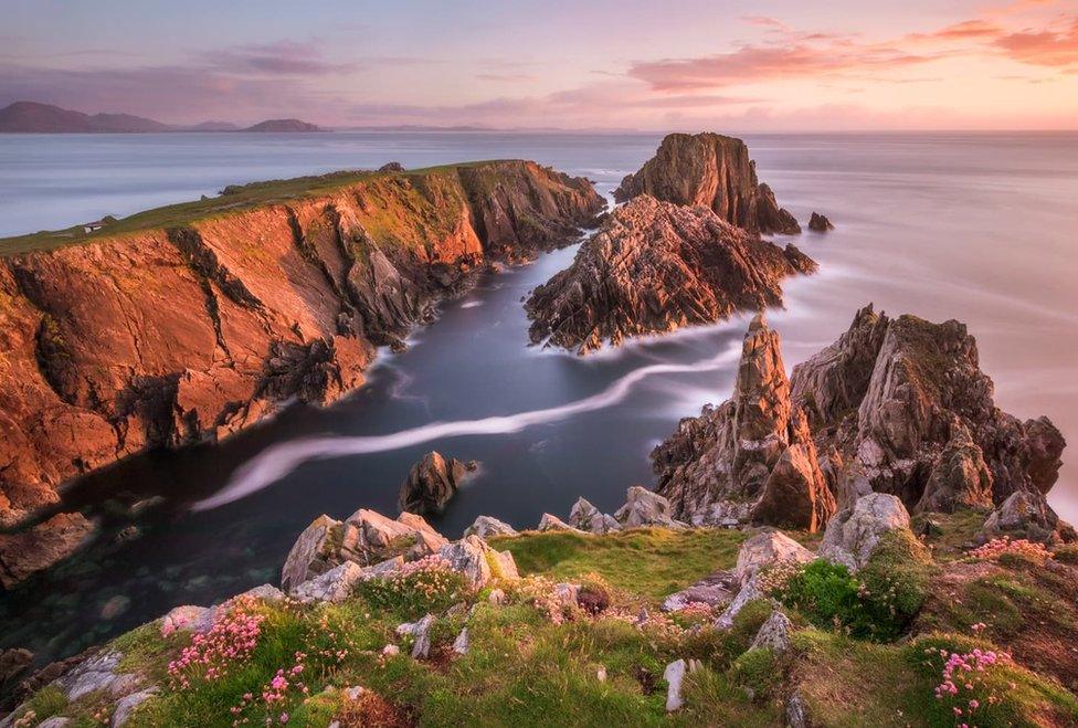 Sunset over the jagged rocks at Malin Head in County Donegal