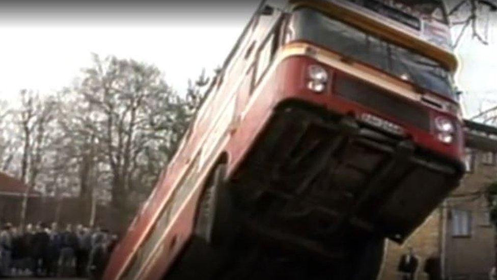 Bus sticking up from sinkhole in Earlham Road, Norwich