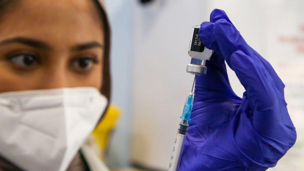 NHS worker preparing to inject a Covid vaccine