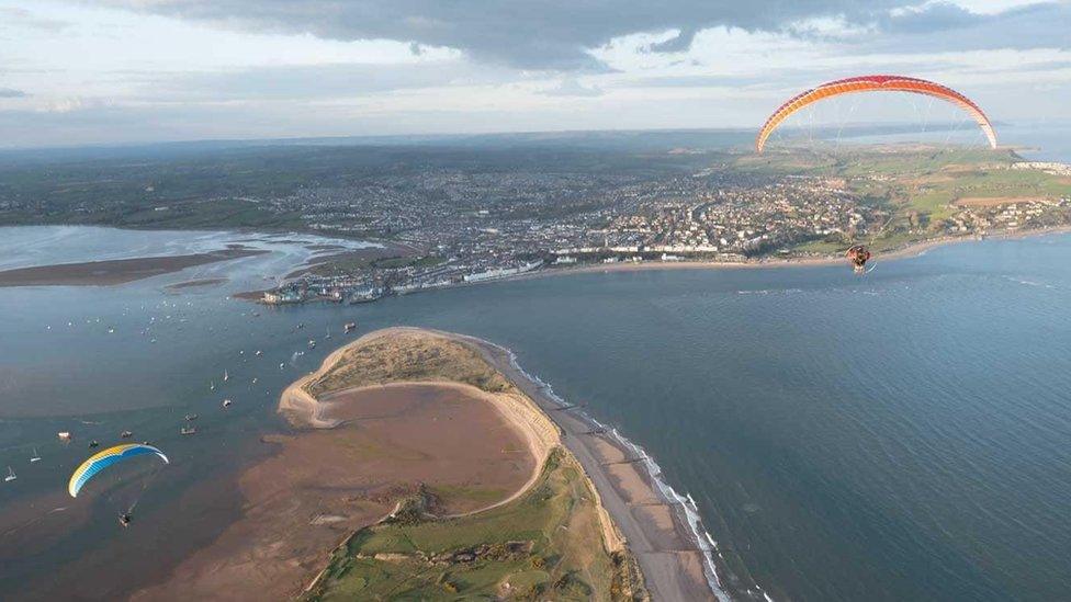 Paramotors flying over the coast