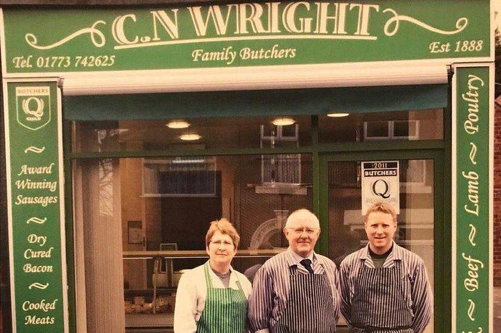 Julie, Arthur and Chris Wright outside their shop