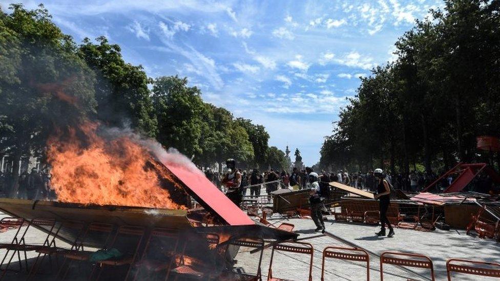 Demonstrators set ablaze a barricade at the rally in Nantes, France