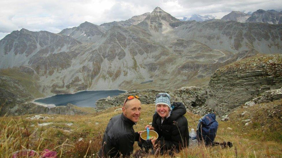 Esther and Dan have a meal on a mountain