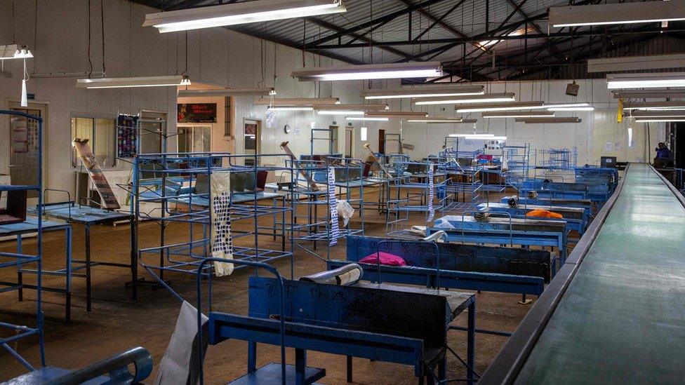 A flower packing line remains empty without workers at a flower farm in Kiambu County, Kenya, on March 24, 2020.