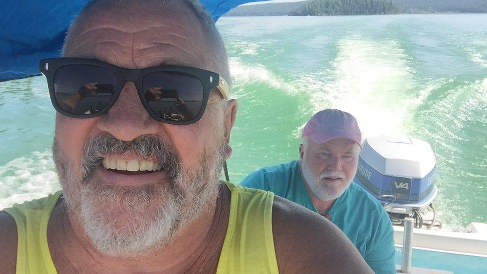 North Munro, pictured here on a boat in Williams Lake, British Colombia, with partner Sean