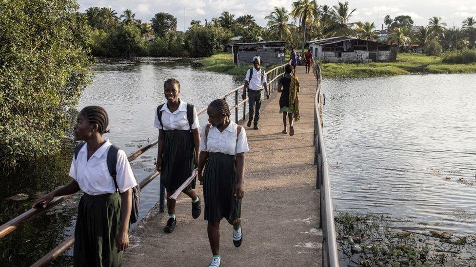 Girls coming home from school in Liberia