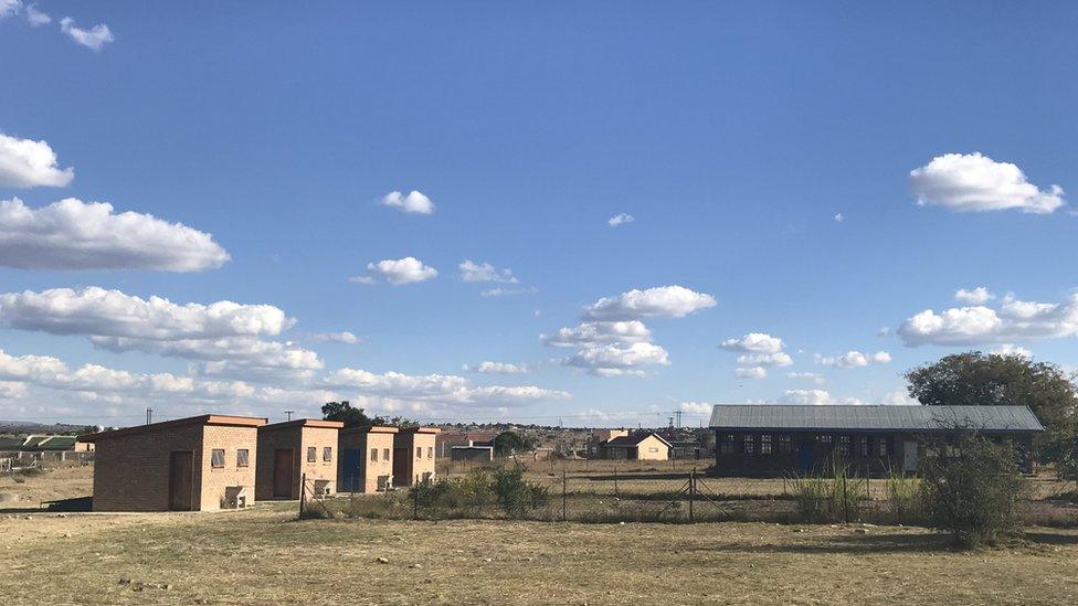 Newly built flush toilets can be seen at Michael’s old school. The pit toilets are less then a metre from there and have since been destroyed and filled-up.