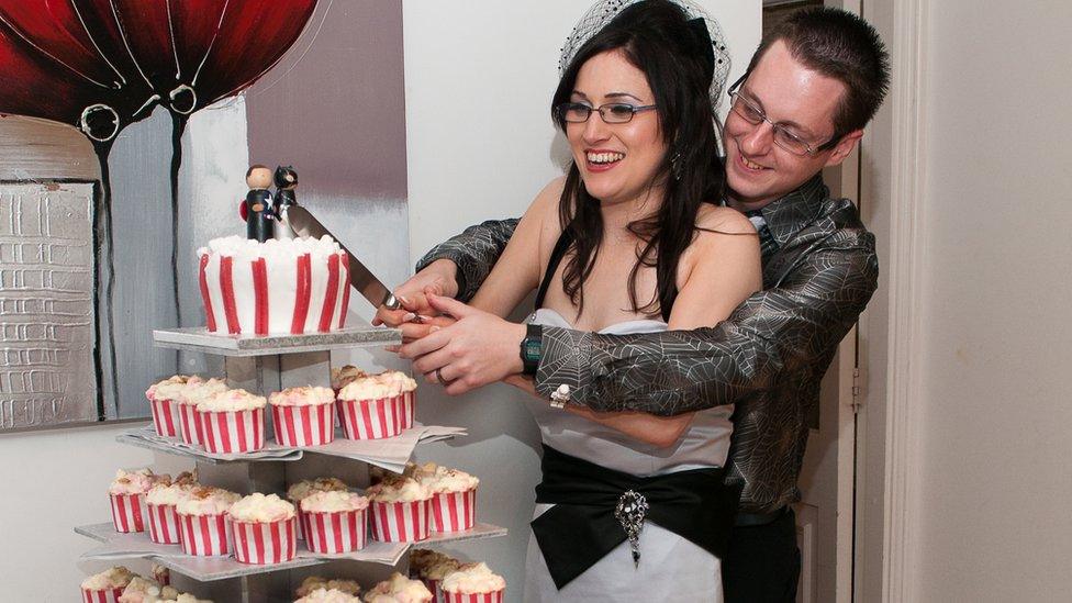 Rachel's wedding cake with a super hero bride and groom on the top