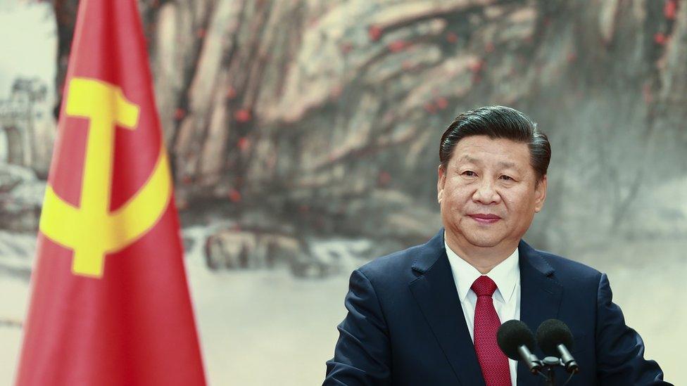 Xi Jinping at the podium during the unveiling of the Communist Party's new Politburo Standing Committee