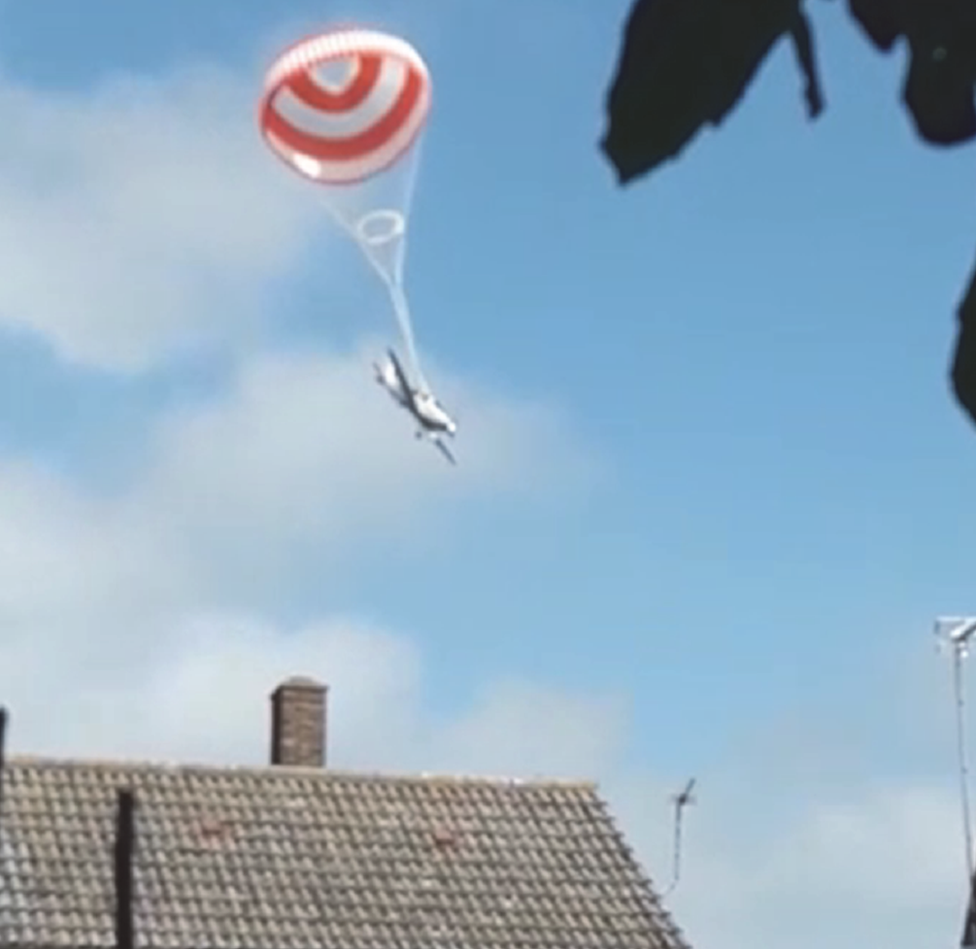 G-SRTT descending under the parachute