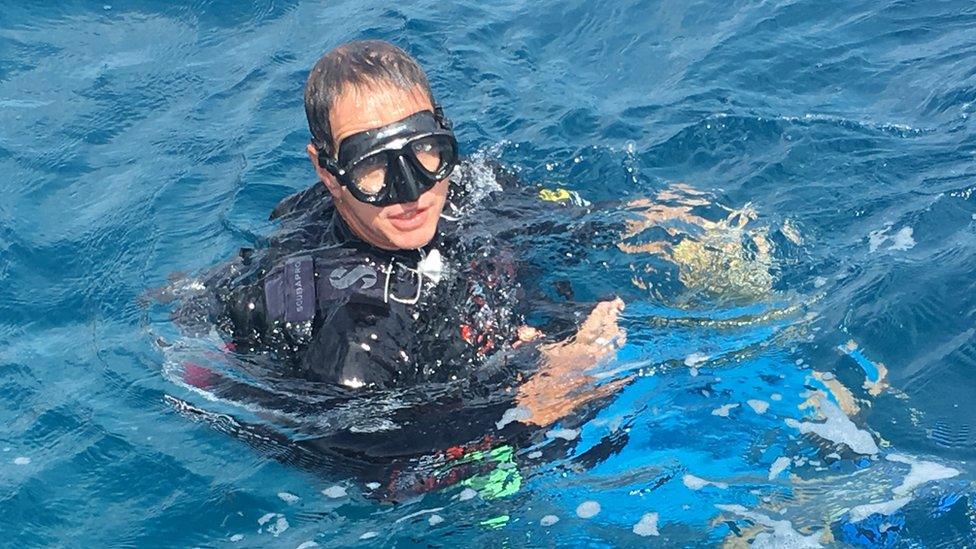 Dr Andrew Hoey inspects the mass bleaching event