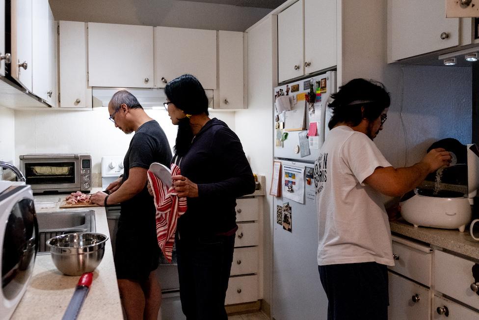 Miguel's family cooks in the kitchen