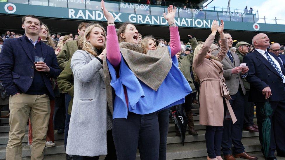 Racegoers celebrate at Aintree