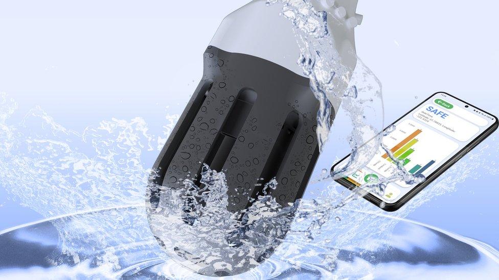 Concept image of the OASIS submerged in water. A smart phone with a graph is next to it, reading the word "safe", indicating that the water quality is good