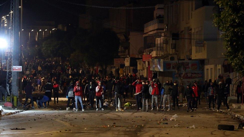 Demonstrators clash with security forces during anti-government protests in Tunis, Tunisia, 18 January 2021.