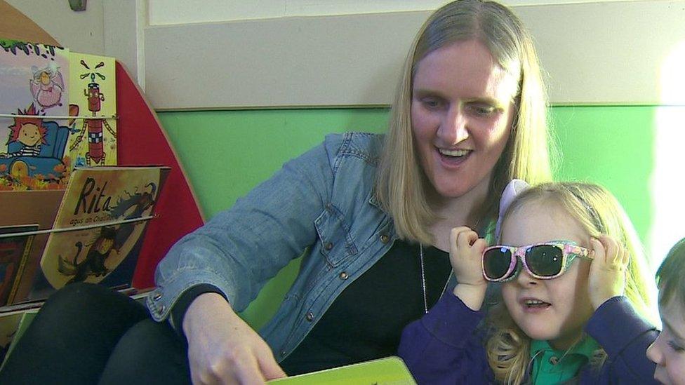 Natalie and daughter reading book