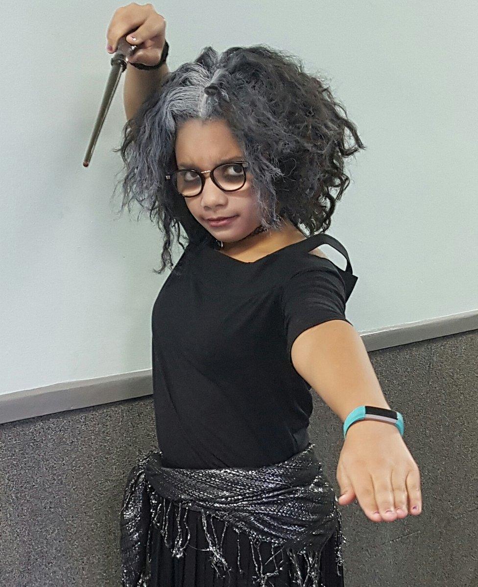 Ten-year-old Aliyah, from Staffordshire, is dressed as Bellatrix Lestrange from Harry Potter with a homemade wand!