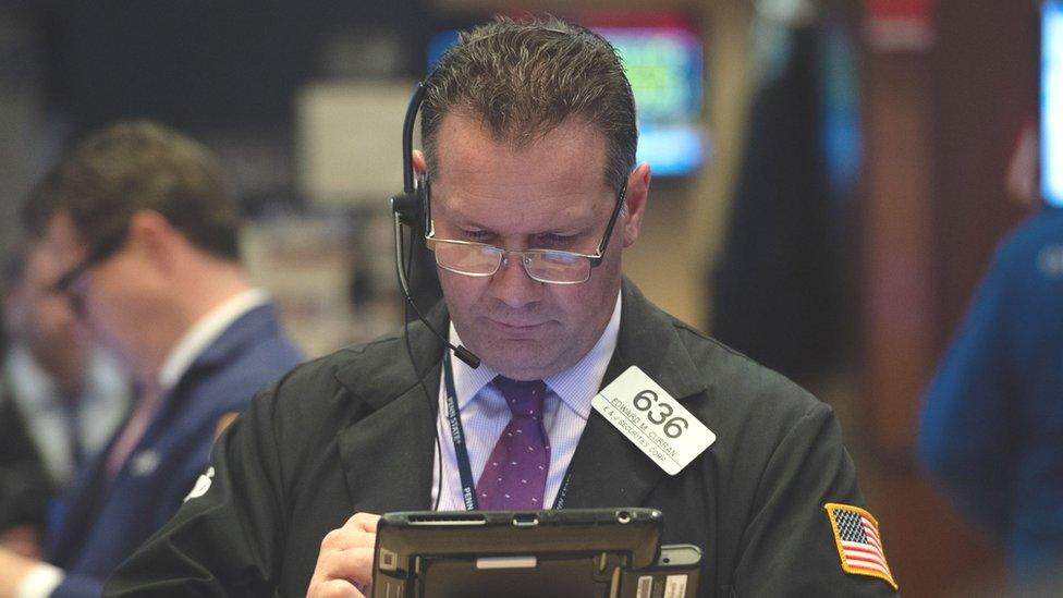 Traders work the floor at the closing bell of the Dow Industrial Average at the New York Stock Exchange on October 24, 2018 in New York