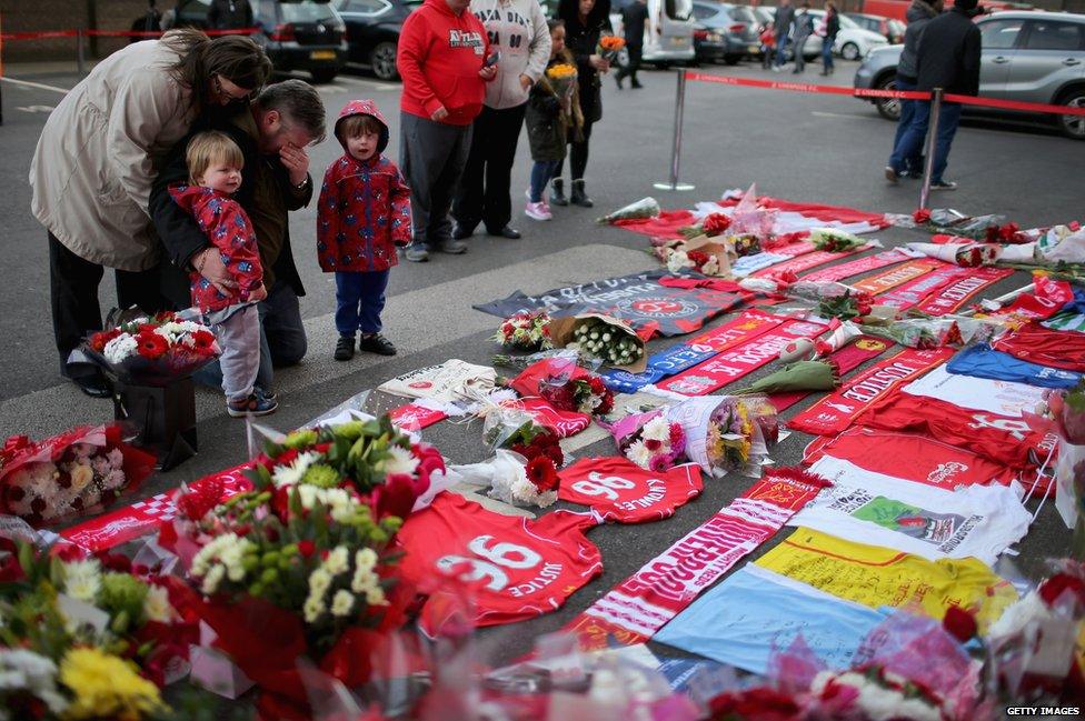 People lay tributes to the Hillsborough victims