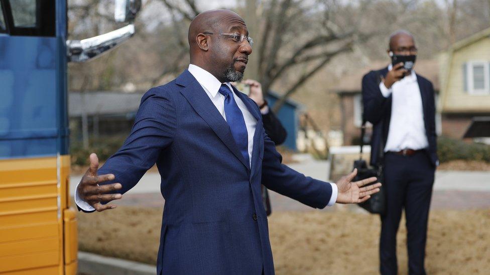 Democratic Senate candidate Rev. Raphael Warnock speaks outside his campaign