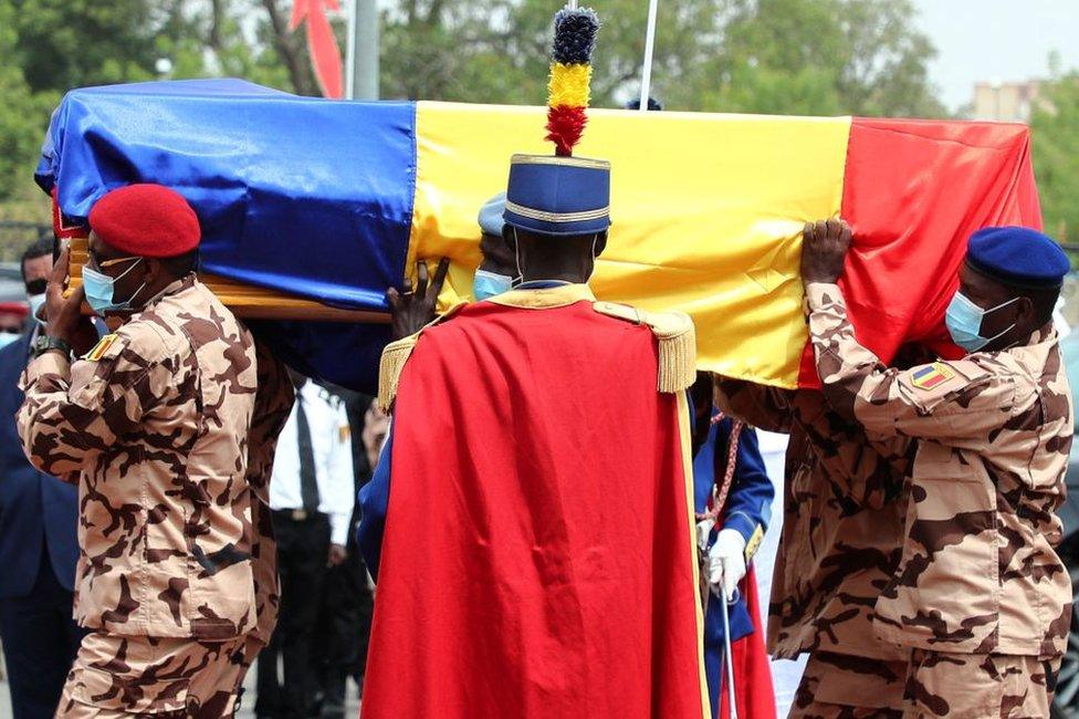 Chadian soldiers carry the coffin of the late Chadian president Idriss Deby during the state funeral in N'Djamena on April 23, 2021.