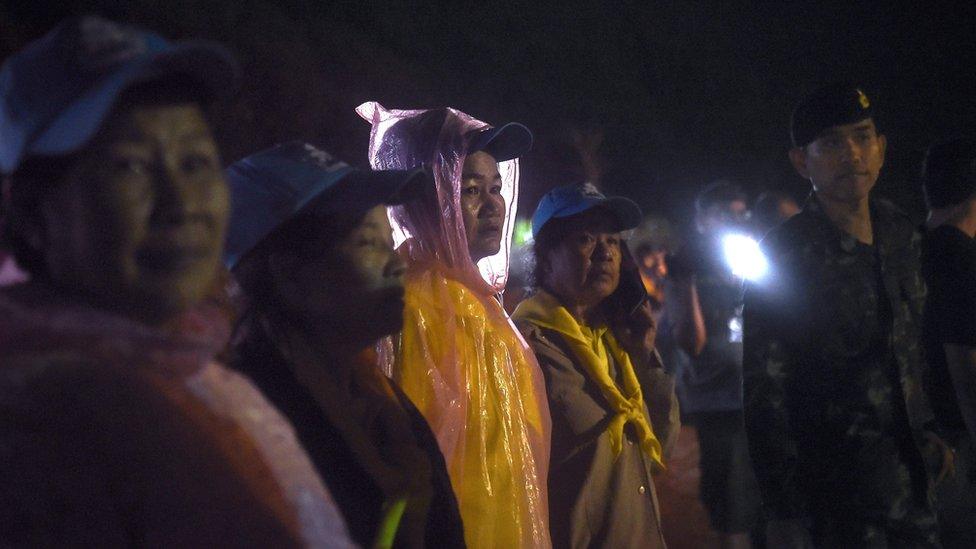 Volunteers waiting at the side of a road