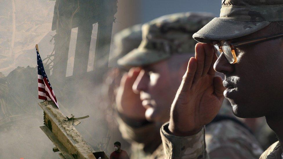 Ground zero rubble on 9/11, US soldiers saluting.