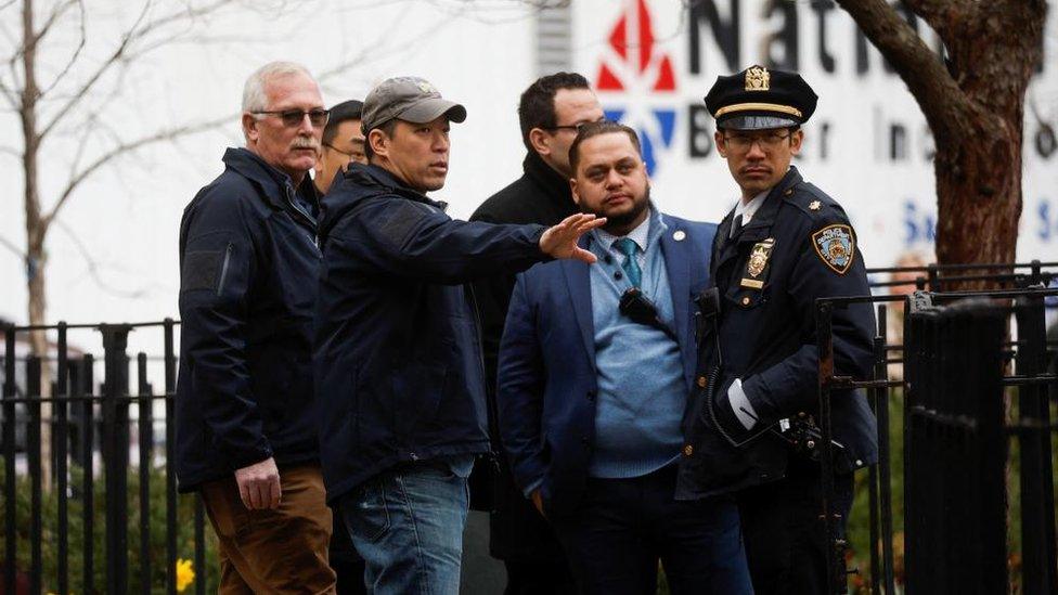 Members of law enforcement were seen discussing security near the courthouse