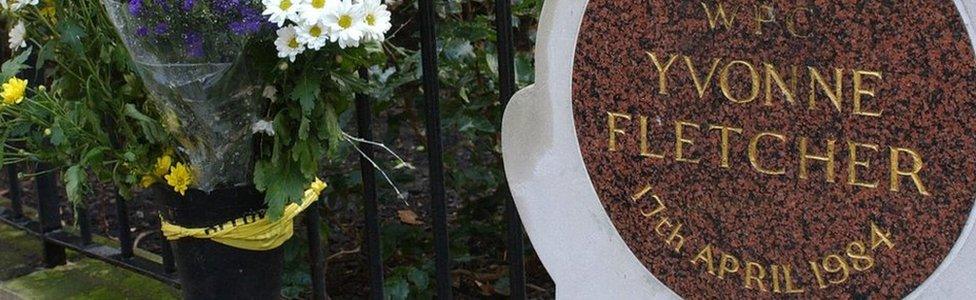 Flowers beside the memorial plaque for Yvonne Fletcher