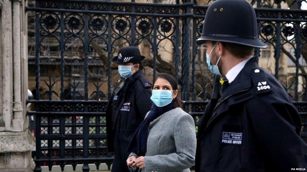 Priti Patel and Met Police officers