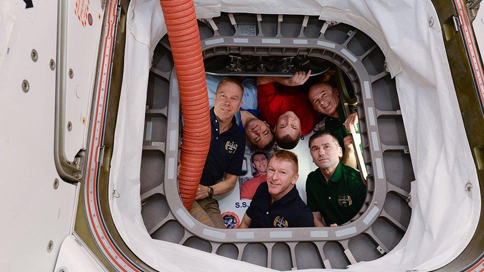 Expedition 47 crew poses for photo inside Cygnus