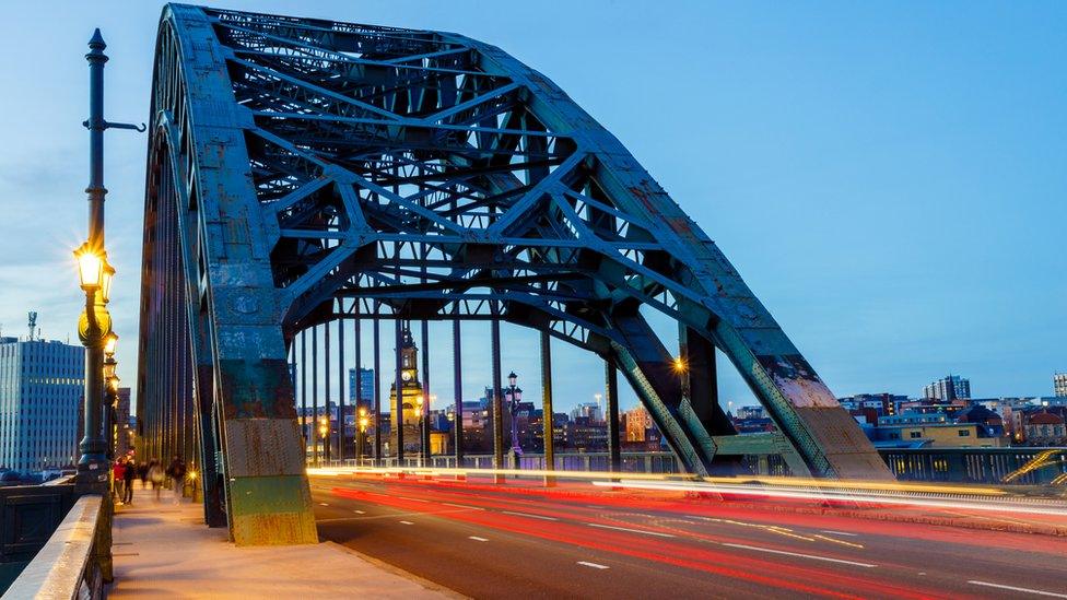 Long exposure shot of blurred car headlights crossing the Tyne bridge