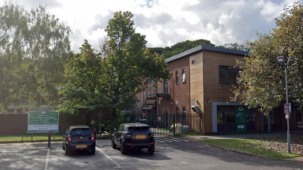 Google streetview of a school building surrounded by trees