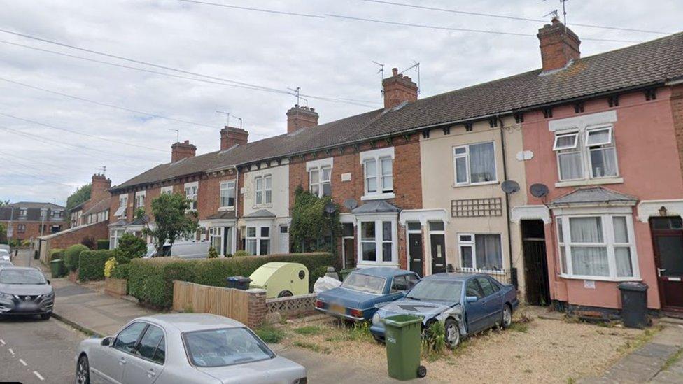 A row of terraced houses in Queens Drive West