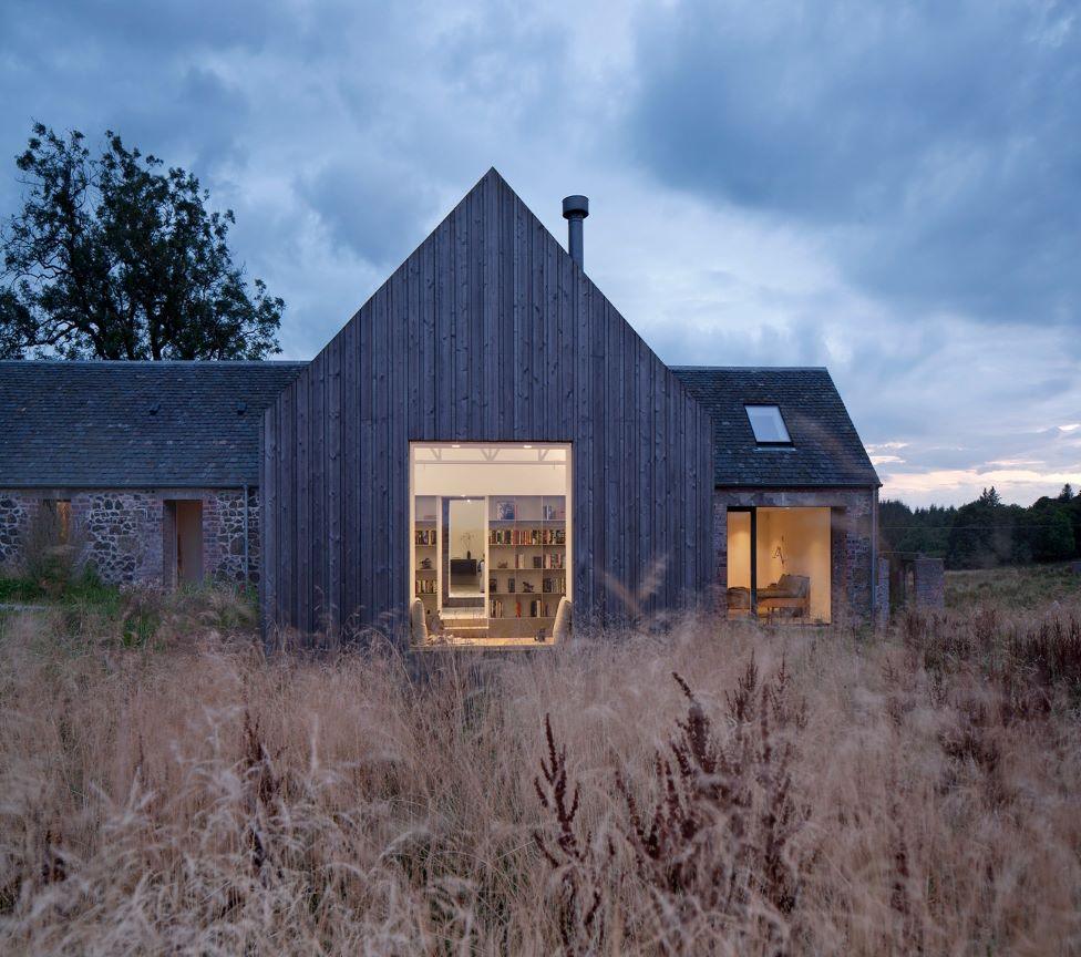 Cuddymoss is a timber covered cottage built around a ruined stone building.