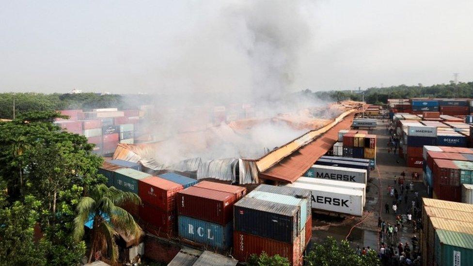 Smoke rises from the storage depot