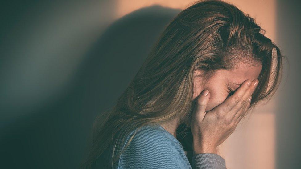 Girl hiding her face